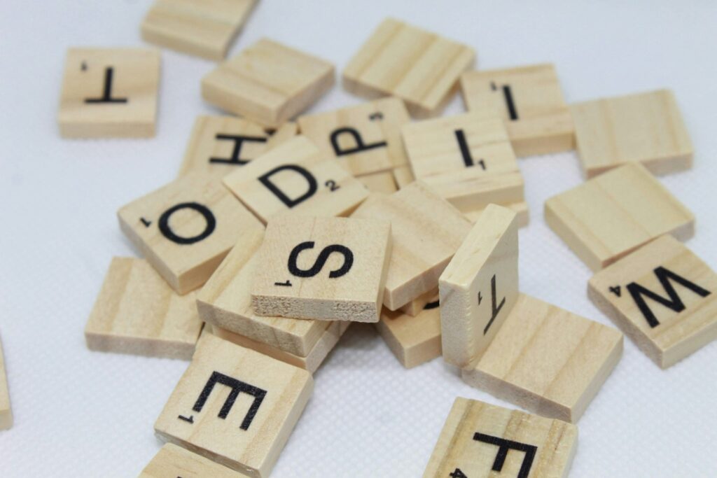 Wooden letter blocks on a white surface